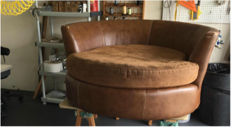 worn brown chair